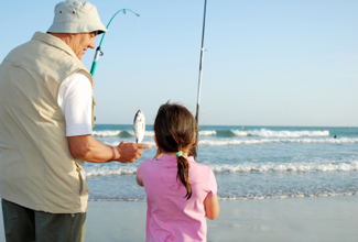 photo: man fishing with child